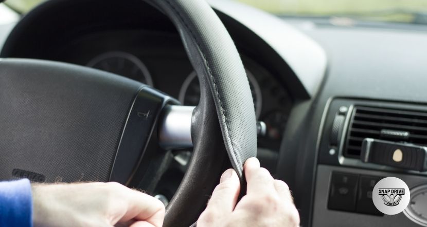 how to remove steering wheel cover