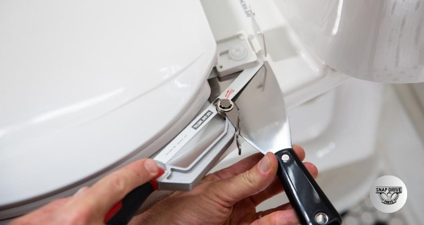 how to remove toilet seat cover
