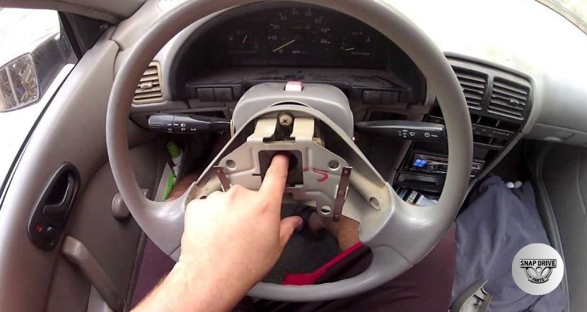 how to take a steering wheel cover off