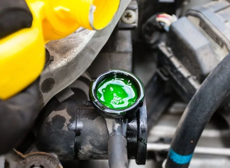 can you add coolant to a hot engine