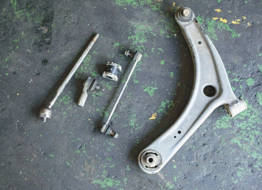 how to replace lower control arm bushings